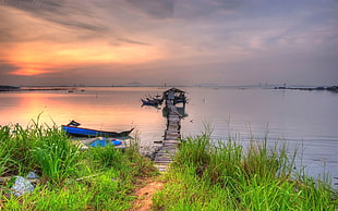boat near dock during golden hour HD wallpaper