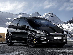 black 5-door hatchback near white mountains during daytime HD wallpaper