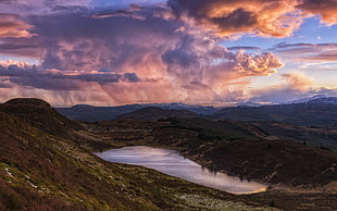 photography of lake surrounded by mountain during golden hour HD wallpaper