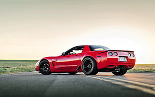 red sports coupe on highway road pavement high-saturated photography HD wallpaper