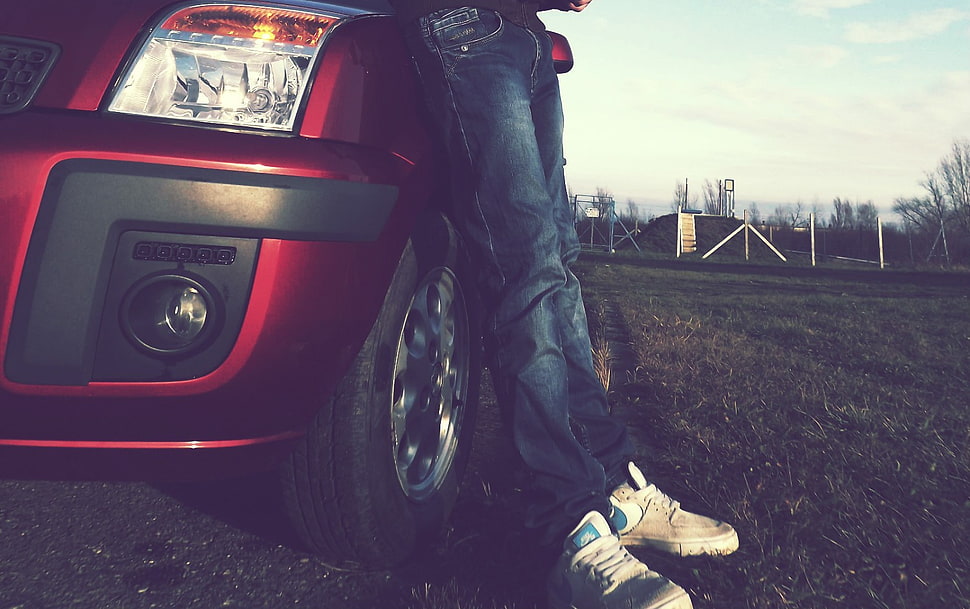 person in blue jeans leaning on red car, Ford, Nike, car, ford fusion HD wallpaper