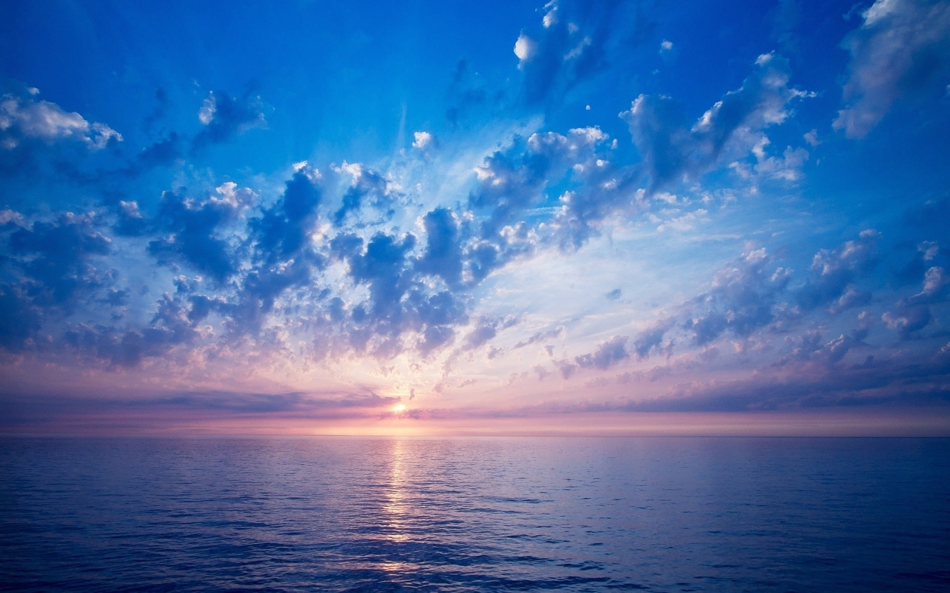 photography blue body of water during sunrise