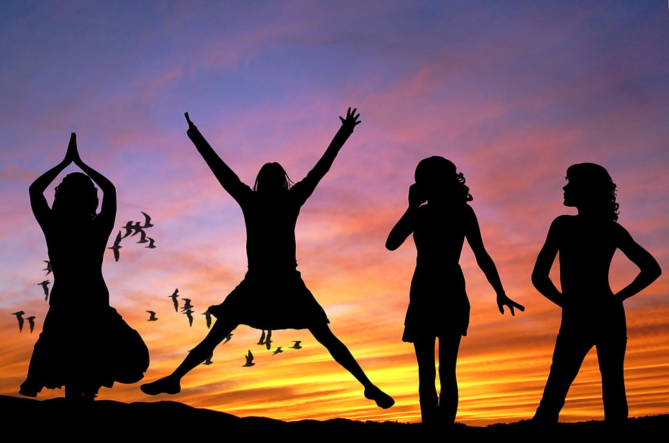 silhouette of four woman under orange sky HD wallpaper