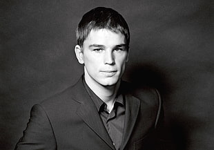 grayscale photography of a man wearing suit jacket