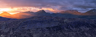 aerial view of gray mountain under sunset