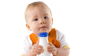 baby holding a bottle HD wallpaper