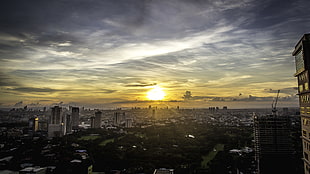 Aerial photography of city near body of water during golden hour, manila HD wallpaper