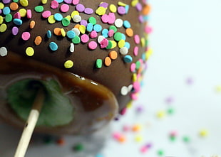 macro shot brown and green lollipop, apple