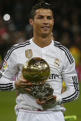 Fly Emirates soccer player holding trophy