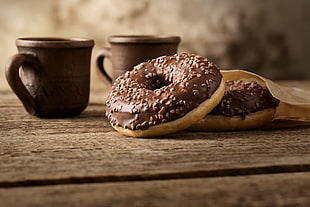 two doughnuts, wooden surface, brown, cup, food HD wallpaper
