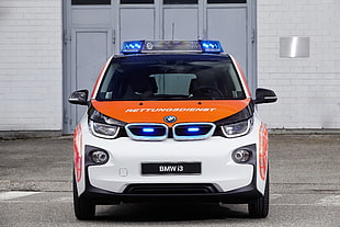 photograph of white and orange BMW i3