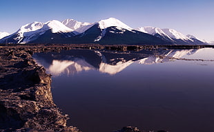 photo of snow mountain near body of water HD wallpaper