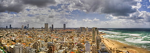 brown and white concrete building, cityscape, sea, sky, clouds