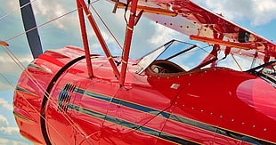 closeup photo of red monoplane