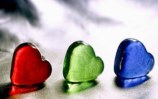 three blue, green, and red heart stone decors HD wallpaper