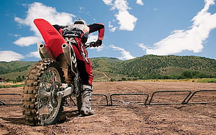 man riding on motocross dirt bike near mountain HD wallpaper