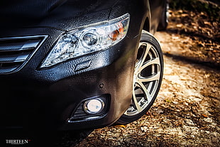 black vehicle front bumper, car, closeup