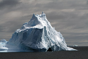 ice berg beside body of water during day time HD wallpaper