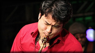 man playing horn instrument