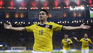 man wearing yellow 10 printed soccer shirt