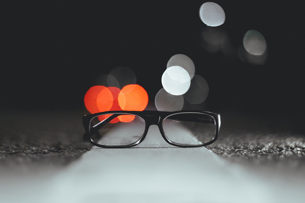 shallow focus photography of clear eyeglasses with black frame HD wallpaper