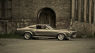 gray Ford Mustang Grande Fastback coupe parked near concrete building during daytime HD wallpaper