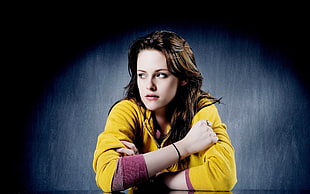 brown haired woman wearing yellow long-sleeved shirt