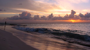 photo of a sunset with body of water