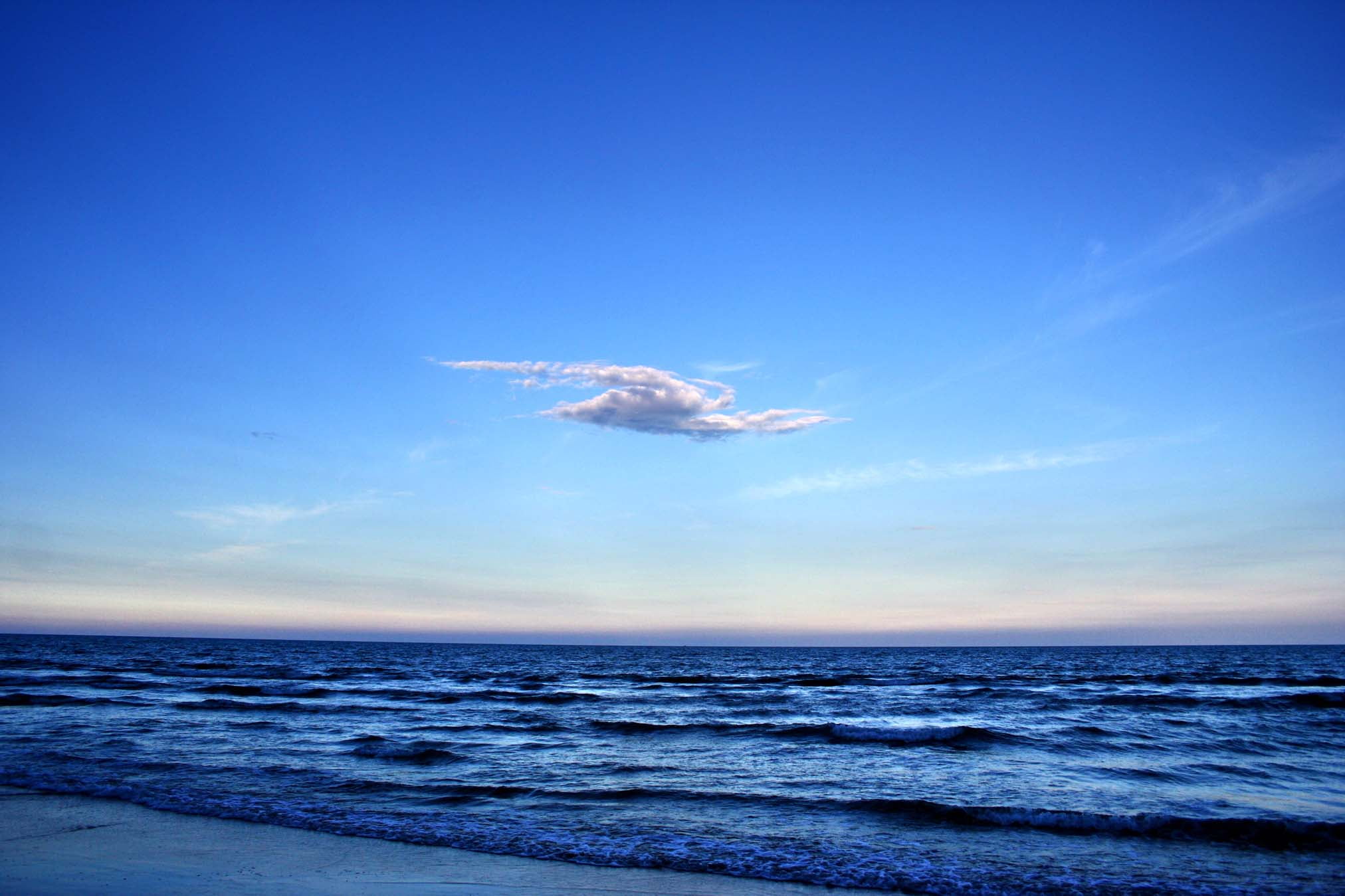 blue sea under blue sky during day time