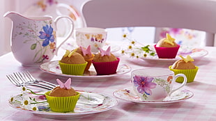 brown cupcake on floral ceramic plate set on table