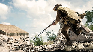 man holding rifle running photo