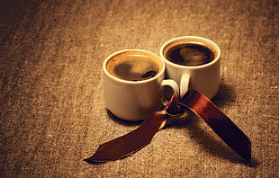 two white ceramic mugs