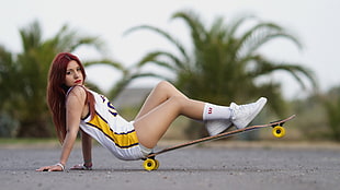 woman sitting on longboard wearing jersey shirt HD wallpaper