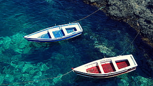 two red and blue dinghy boats near gray rock, boat HD wallpaper