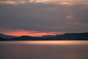 silhouette photo of mountain during sunset