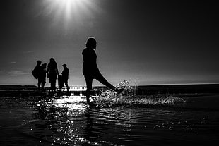 grayscale photo of people standing on body of water HD wallpaper