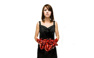 woman in black sleeveless dress holding human intestine HD wallpaper