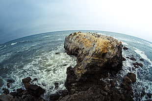 fish-eye photo of rock and body of water HD wallpaper
