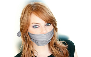 woman in black shirt with mouth covered by a grey cloth HD wallpaper