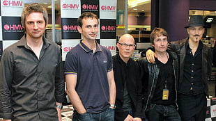group of five men wearing black top HD wallpaper