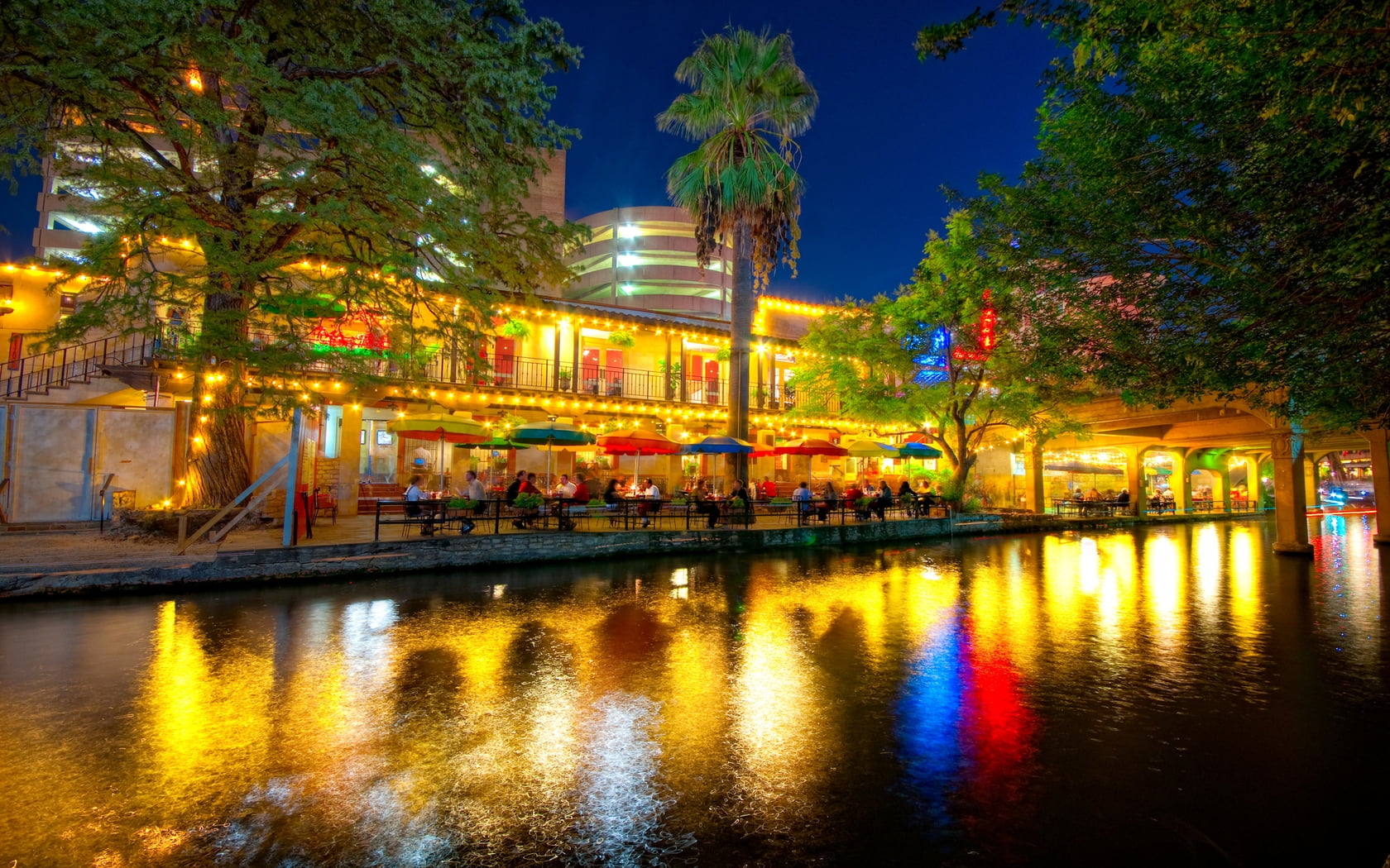 Cafe store and lake side view during night time photography