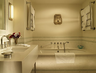 white towel hanged on the bathtub HD wallpaper