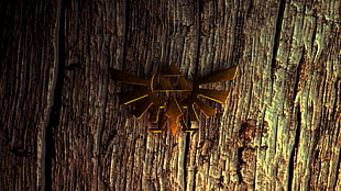 gold eagle badge on tree stem wallpaper HD wallpaper