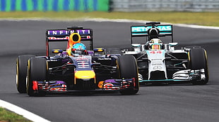 two F1 vehicles, Formula 1, motorsports, Sebastian Vettel, Lewis Hamilton HD wallpaper