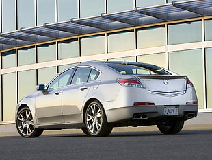 silver Acura sedan on road