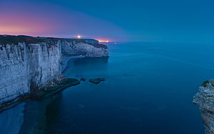 body of water, cliff, beach, sea, lights