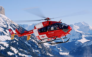 flying red Medic Helicopter under blue sunny sky HD wallpaper