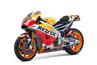 yellow, red, and red Repsol sports bike