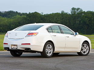 white Acura TL parked on gray concrete road during daytime HD wallpaper