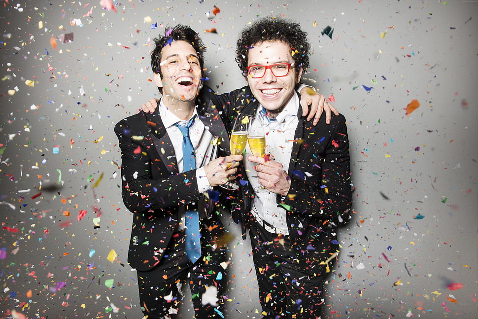 two men in black formal suit jacket surrounded by confetti HD wallpaper